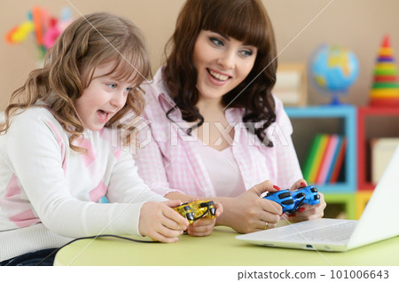 cute girl using laptop 101006643