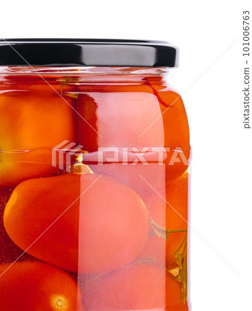 Pickled tomatoes in glass jar on white background Pickled tomatoes in glass jar on white background 101006763