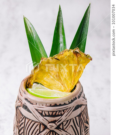 Tropical pineapple cocktail drink with lime 101007034