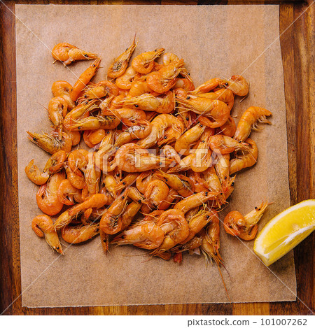 Small cooked shrimp on wooden tray Small cooked shrimp on wooden tray 101007262