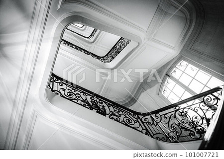 View bottom up on beautiful luxury staircase with wooden railings View bottom up on beautiful luxury staircase with wooden railings 101007721
