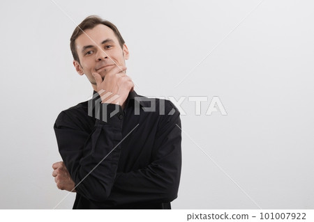 Caucasian man 30s in a black shirt portrait on white background Caucasian man 30s in a black shirt portrait on white background 101007922