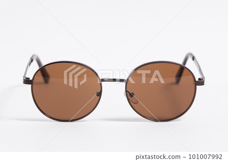 Brown sunglasses isolated on white background close-up, fashionable trendy stylish accessory 101007992