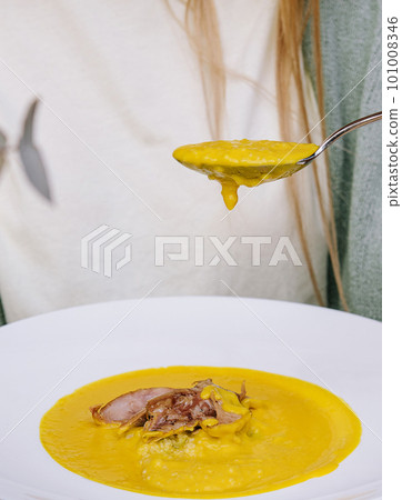 Pink salmon fish soup with cream in a white bowl Pink salmon fish soup with cream in a white bowl 101008346