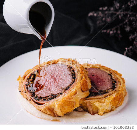 Fillet wellington in puff pastry on plate Fillet wellington in puff pastry on plate 101008358