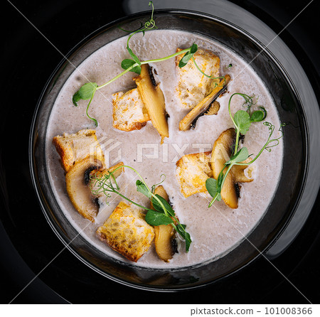 Creamy mushroom soup with champignons top view Creamy mushroom soup with champignons top view 101008366
