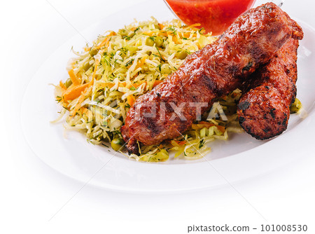 Moldavian Traditional Mititei Mici Meat Sticks with Cabbage and a Sauce Moldavian Traditional Mititei Mici Meat Sticks with Cabbage and a Sauce 101008530