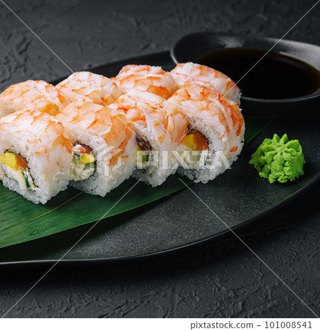 shrimp rolls on black stone plate 101008541