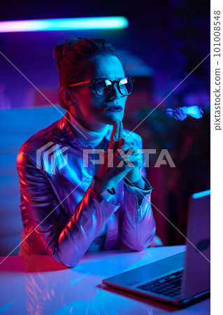 pensive trendy 40 years old woman in glasses with laptop 101008548