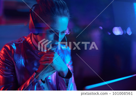 pensive elegant female with laptop talking video call 101008561