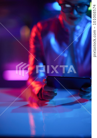 Closeup on female using smartphone app 101008574