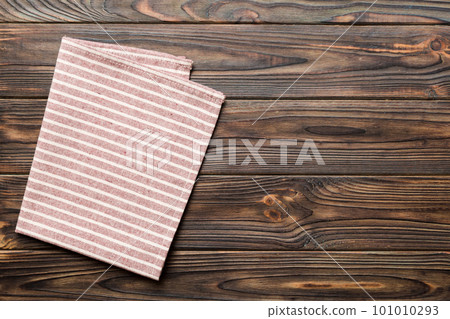 top view with red empty kitchen napkin isolated on table background. Folded cloth for mockup with copy space, Flat lay. Minimal style top view with red empty kitchen napkin isolated on table background. Folded cloth for mockup with copy space, Flat lay. Minimal style 101010293