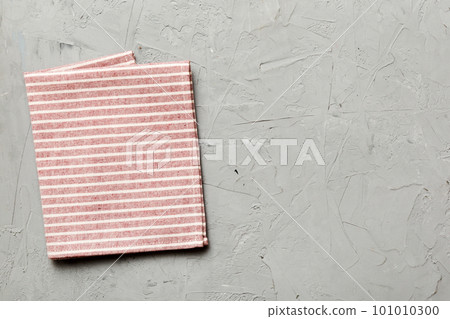 top view with red empty kitchen napkin isolated on table background. Folded cloth for mockup with copy space, Flat lay. Minimal style top view with red empty kitchen napkin isolated on table background. Folded cloth for mockup with copy space, Flat lay. Minimal style 101010300