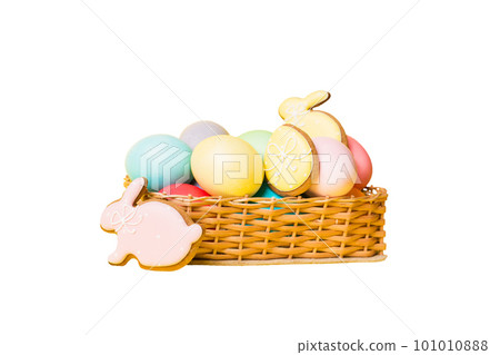 Colorful easter cookies in basket with Multi colors Easter eggs isolated on white background. Pastel color Easter eggs. holiday concept 101010888