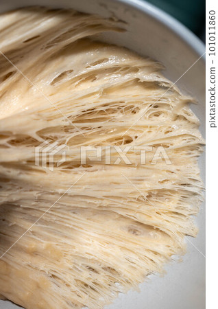Close up sourdough bread dough starter texture, baking homemade bread. 101011860