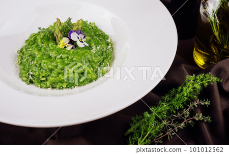 Dish of risotto with asparagus closeup 101012562