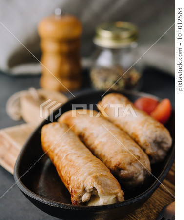 Grilled sausage on pan close up Grilled sausage on pan close up 101012563
