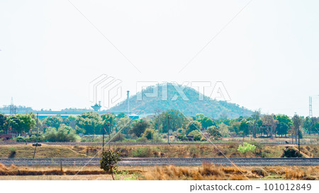 Barren fields landscape view of Chota Nagpur Plateau against distant mountain in the background. Ramgarh Jharkhand India 101012849