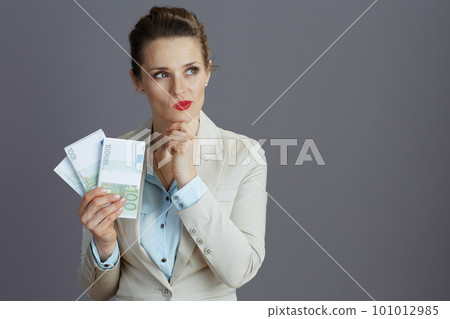 pensive stylish female employee in light business suit pensive stylish female employee in light business suit 101012985