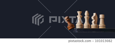 White chess pieces displace the black pawn. The concept of a team game. 101013082