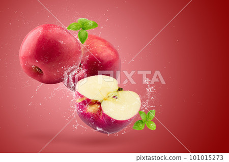 Creative layout made from Fresh Red Apple fruit  and water Splashing on a red background. 101015273