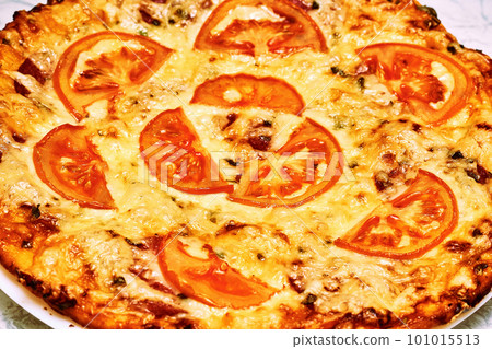 Ready to eat baked pizza. Delicious Italian dish with a variety of toppings Ready to eat baked pizza. Delicious Italian dish with a variety of toppings 101015513