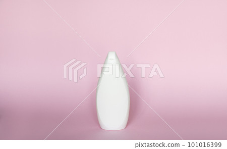 White bottle for liquid soap, shampoo, gel on pink background. 101016399