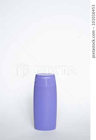Violet plastic bottle of body care and beauty products. Studio photography of plastic bottle for shampoo, shower gel, creme isolated on white background. Violet plastic bottle of body care and beauty products. Studio photography of plastic bottle for shampoo, shower gel, creme isolated on white background. 101016453