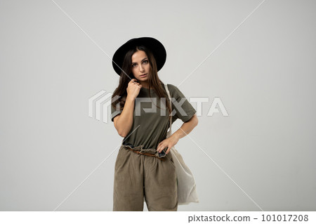 Woman with white cotton bag in her hands. Girl holding textile grocery bag with vegetables. Zero waste concept. Woman with white cotton bag in her hands. Girl holding textile grocery bag with vegetables. Zero waste concept. 101017208