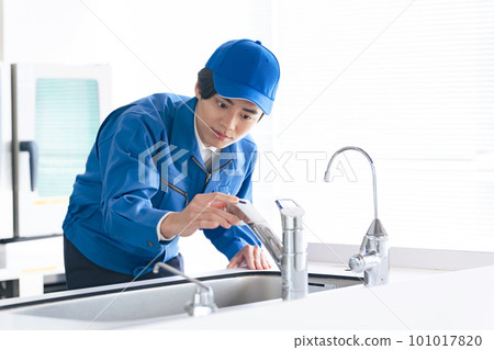 Male worker checking the water supply Male worker checking the water supply 101017820