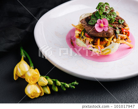 Beef medallions with fresh salad on plate Beef medallions with fresh salad on plate 101017947