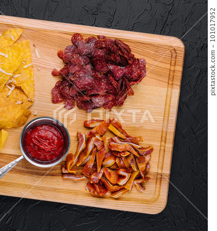 sujuk, smoked pork ears and mexican chips 101017952