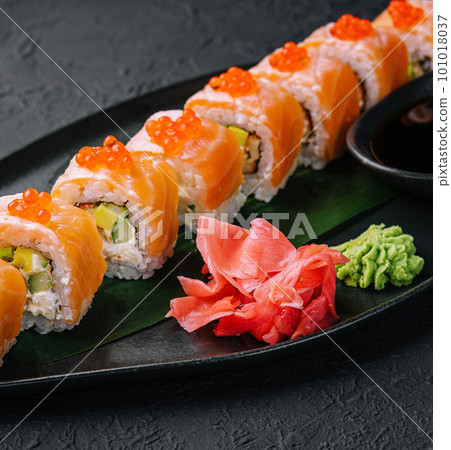 philadelphia sushi with red caviar on plate philadelphia sushi with red caviar on plate 101018037