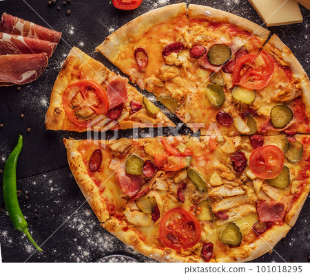 pizza with sausage, ham and chicken pizza with sausage, ham and chicken 101018295