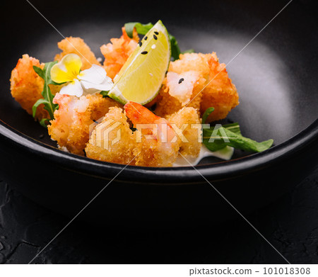 fried crispy shrimp on black plate fried crispy shrimp on black plate 101018308