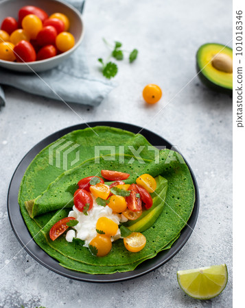 crepes with spinach, cottage cheese and fresh vegetables 101018346