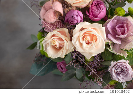 original bouquet of roses with brassica on gray background original bouquet of roses with brassica on gray background 101018402