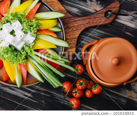 chopped vegetables with goat cheese top view 101019933