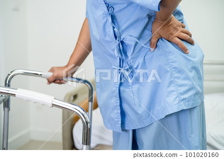 Asian lady patient use walker in hospital to support walking. 101020160