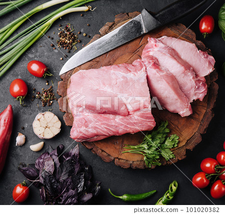 Raw pork neck meat cuts with spices 101020382
