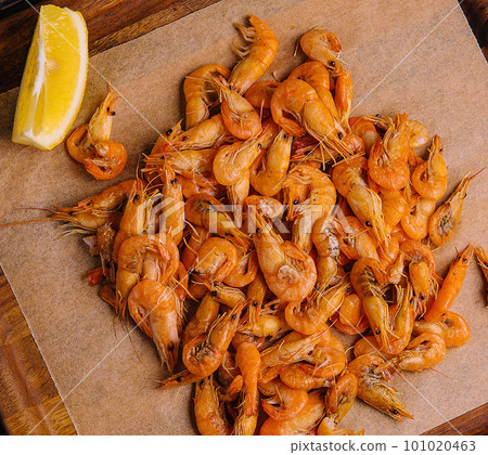 Small cooked shrimp on wooden tray Small cooked shrimp on wooden tray 101020463