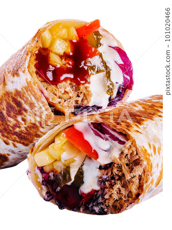 fresh roll of thin lavash or pita bread filled with grilled meat 101020466