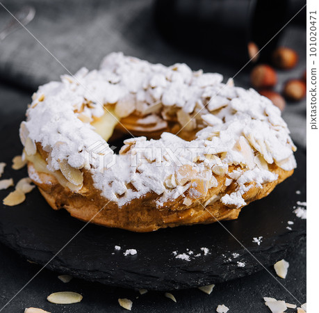 French traditional cake powdered sugar and almond petals French traditional cake powdered sugar and almond petals 101020471