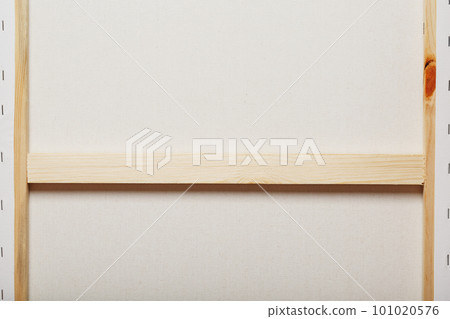 Canvas for artists stretched on a wooden rail, as a background 101020576