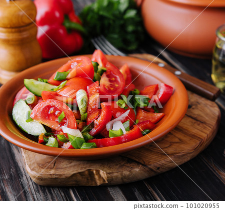 Tomato salad with cucumber, onion and parsley Tomato salad with cucumber, onion and parsley 101020955