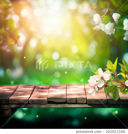 Spring background with empty wooden table. Natural template for product display with cherry blossoms bokeh and sunlight. Empty wooden table in spring blooming cherry orchard during sunny day. 101021108