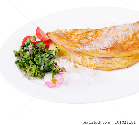 Omelette with ham cherry tomatoes on plate 101021191