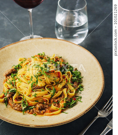 egg pasta tagliatelle with bolognese sauce made from meat and tomato sauce 101021269