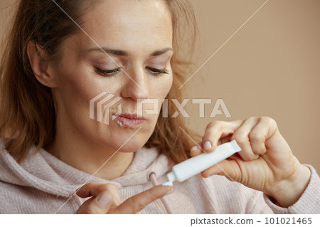 woman with herpes on lips isolated on beige woman with herpes on lips isolated on beige 101021465