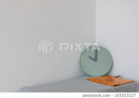 Document bag and clock on the table with empty space. Concept of work and time. Document bag and clock on the table with empty space. Concept of work and time. 101023227